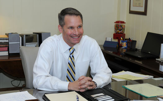 Dr. Noland at his desk