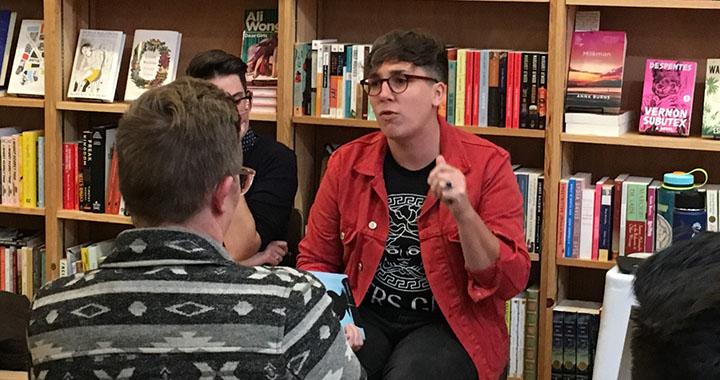person giving book talk at book store