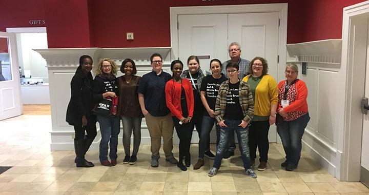 Group of eleven people standing together