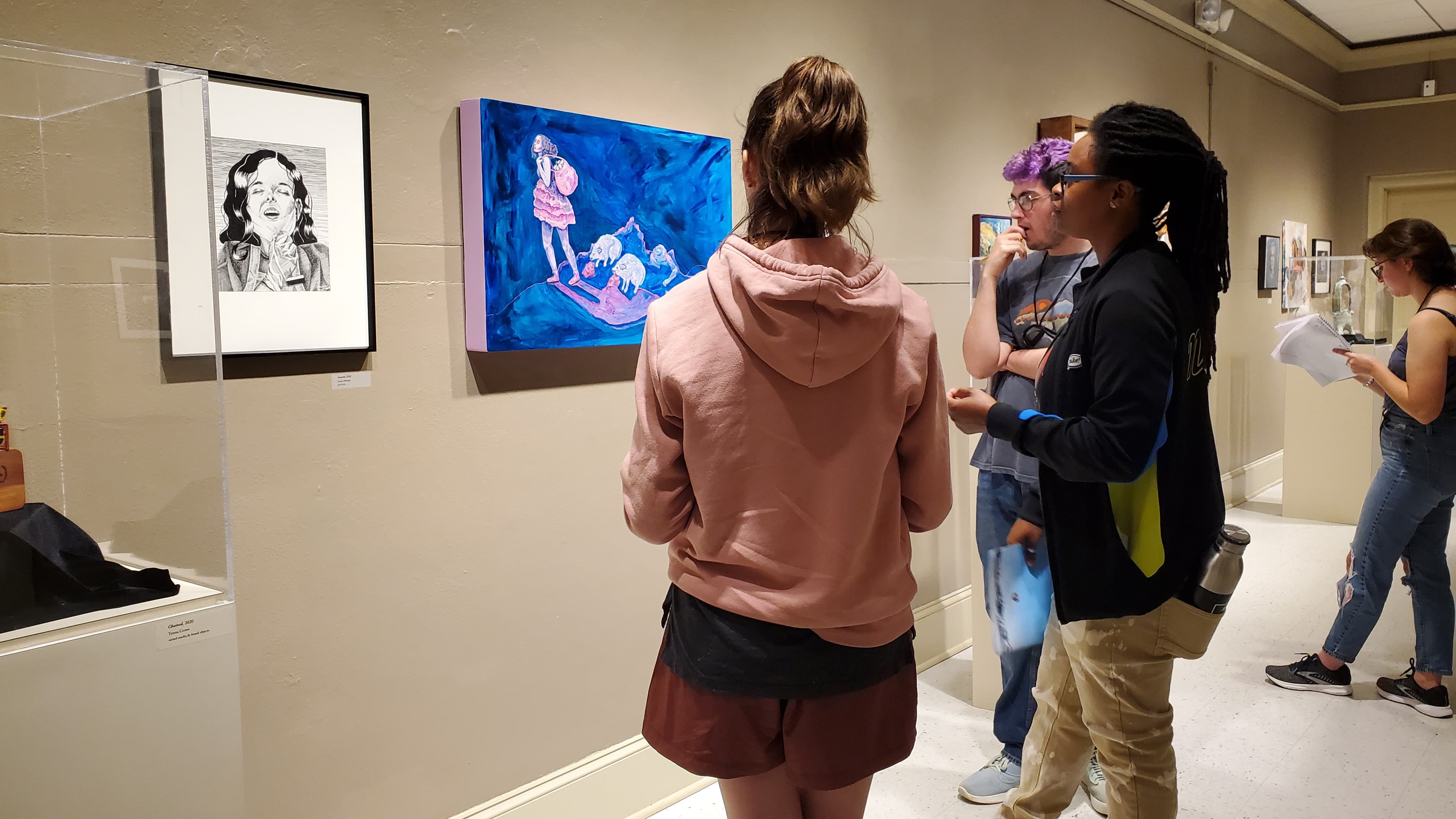 Poet Taria Person and some students discuss art in the Reece Museum and how to transcribe the emotion from an image onto the page. 