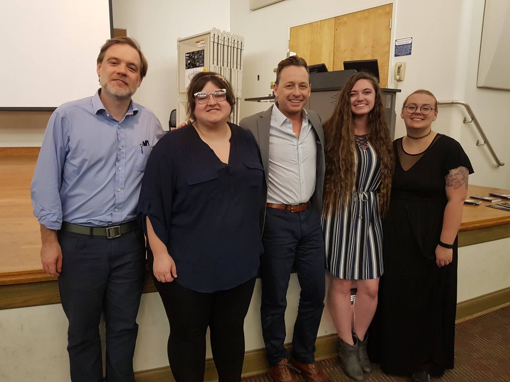 Silas House, Dr. Jesse Graves, and graduate students from the Literature and Language Department pause for a photo following the Seventh Annual Robert "Jack" Higgs Memorial Reading in 2019. 