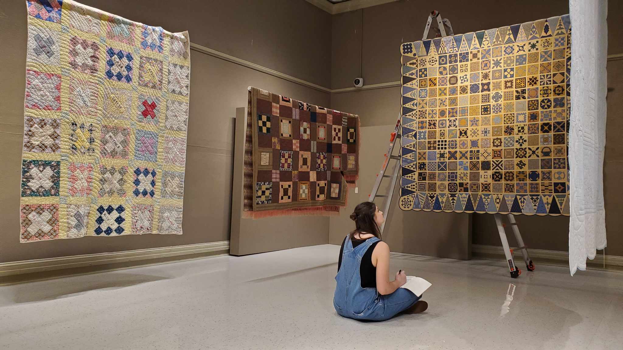 One young writer composes a piece in response to the quilt exhibit in the Reece Museum. 