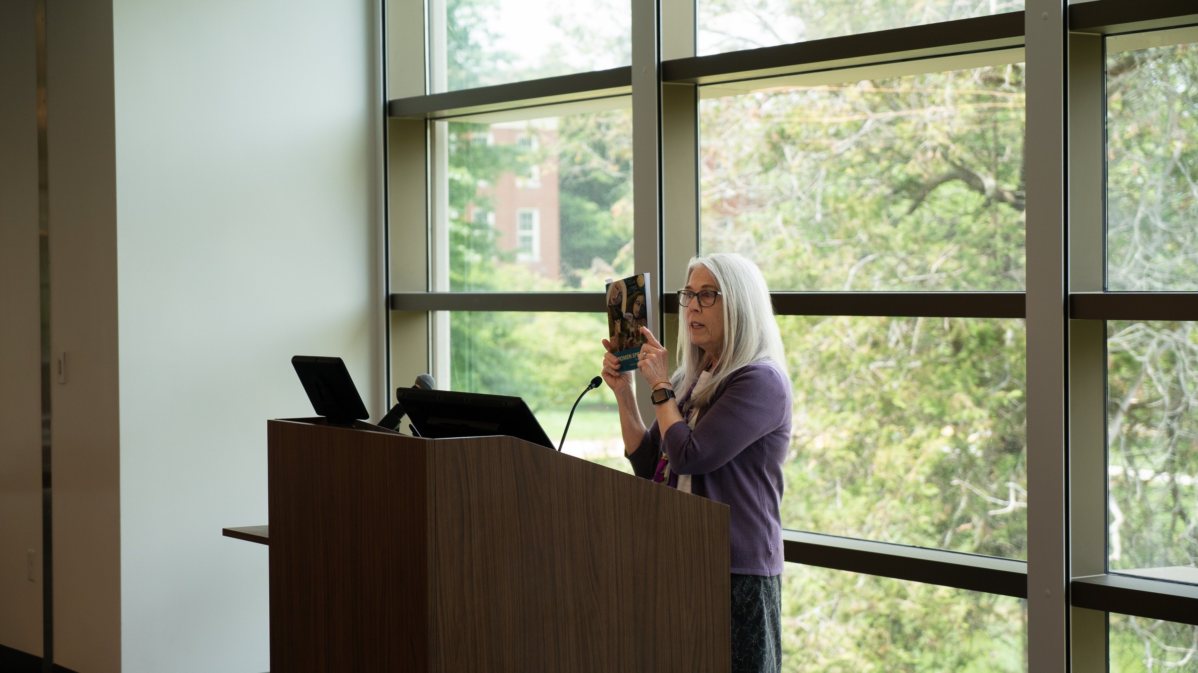 Kari Gunter-Seymour is the Poet Laureate of Ohio and the founder of the Women of Appalachia Project. Here, she holds up the 8th Volume of the "Women Speak" Anthology before the ETSU event. 