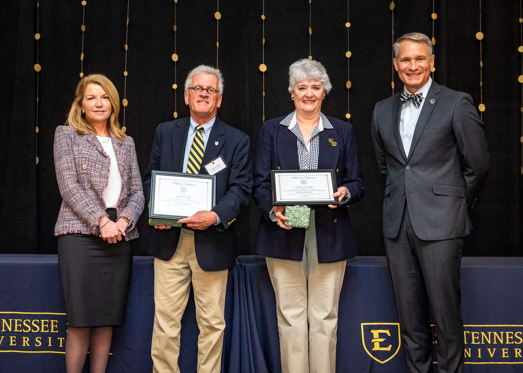 Robert Acuff and Margret Pate both receive awards for 40 years of service.