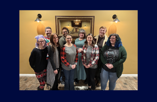 A group of Counseling Center staff members pose for a Christmas party picture.