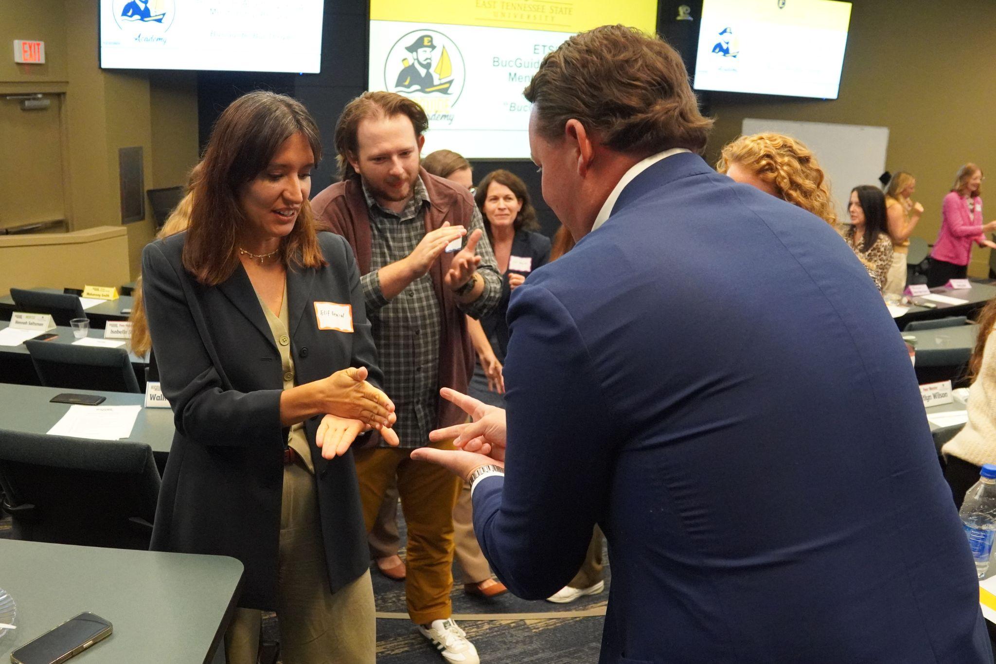 Multiple East Tennessee State University faculty, staff, students, and industry partners play a game at the BucGuide Academy (BGA) meeting.