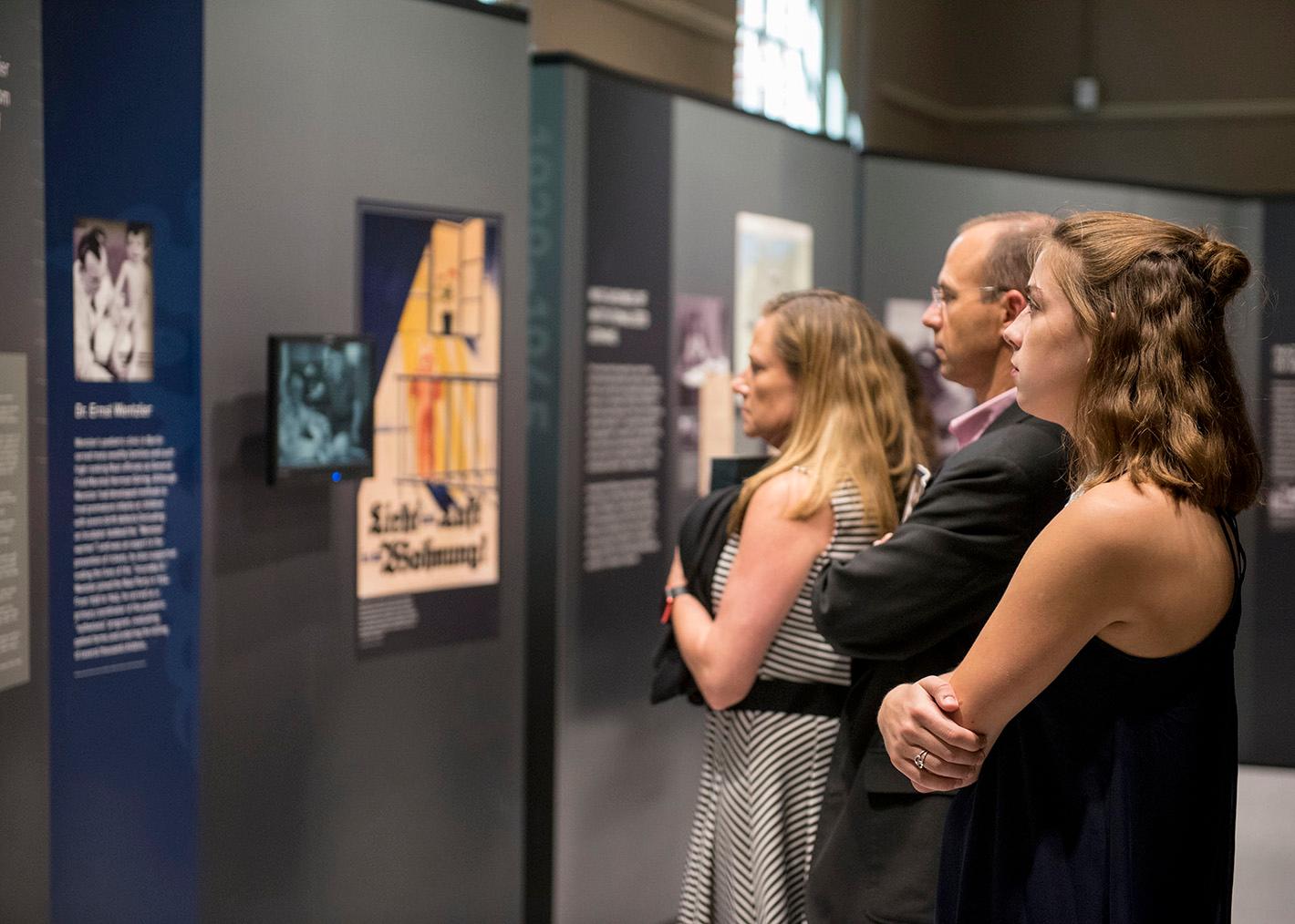 Visitors viewing Deadly Medicine: Creating the Master Race. The exhibition was produced by the USHMM and traveled to the Reece Museum the fall of 2017.