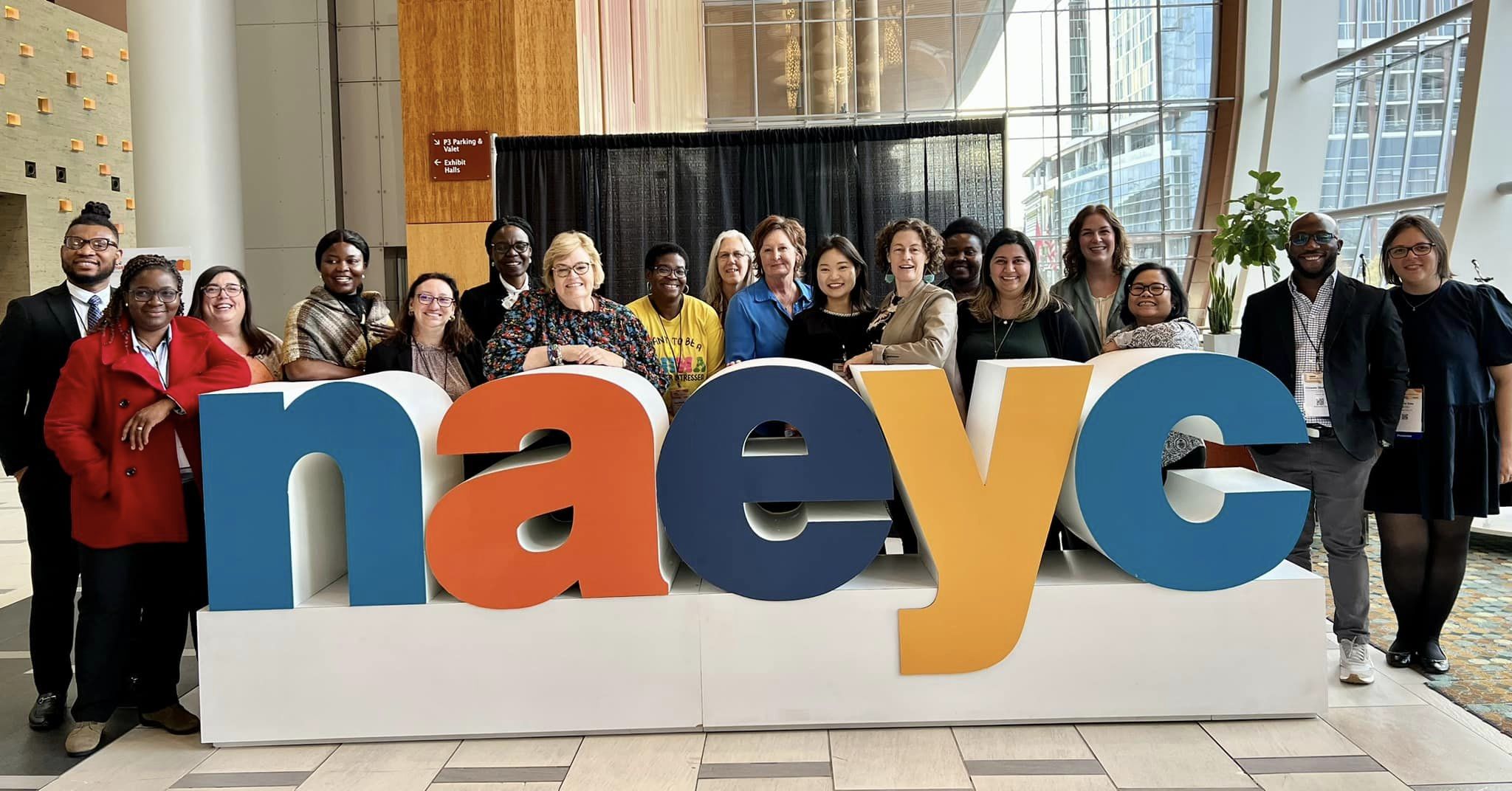 Early Childhood faculty and students at the NAEYC sign at the fall 2023 conference in Nashville.