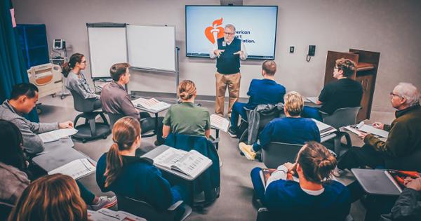 A group of ETSU interprofessional education students sitting in a semi-circle listening to a lecture delivered by Dr. Joe Florence 