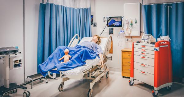 A simulation lab in ETSU's Bishop Hall, featuring a manikin on a hospital bed posing as if giving birth