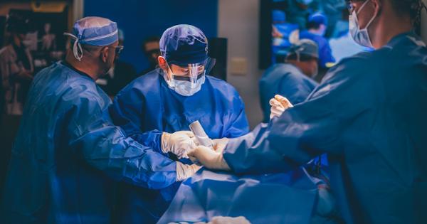 An ETSU student practicing surgery skills in a fully functioning operating room
