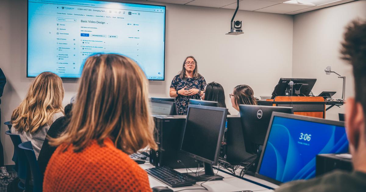 A classroom of ETSU students looking at the front of the classroom towards their lecturer