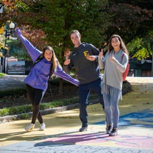 Students posing on sidewalk