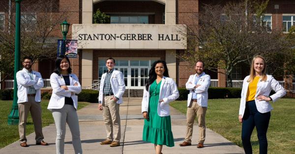 Rural Primary Care Track student standing outfront of Stanton-Gerber Hall