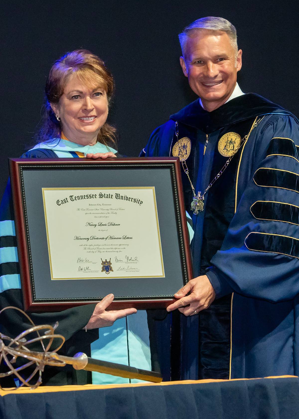 Dr. Dishner receives an honorary degree from Dr. Noland