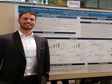 Justin at his poster