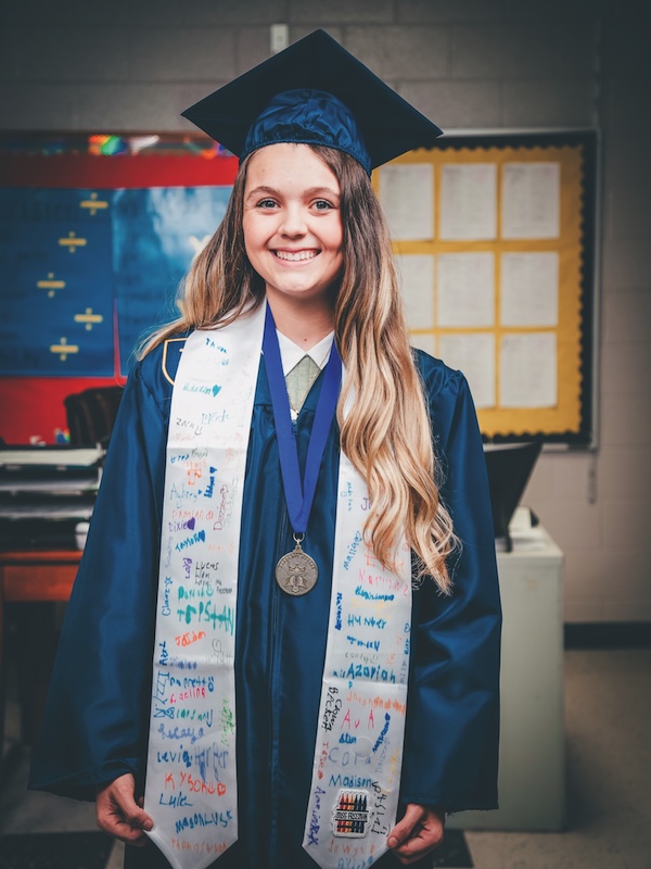 Gracie Freeman wearing her ETSU graduation cap and gown.