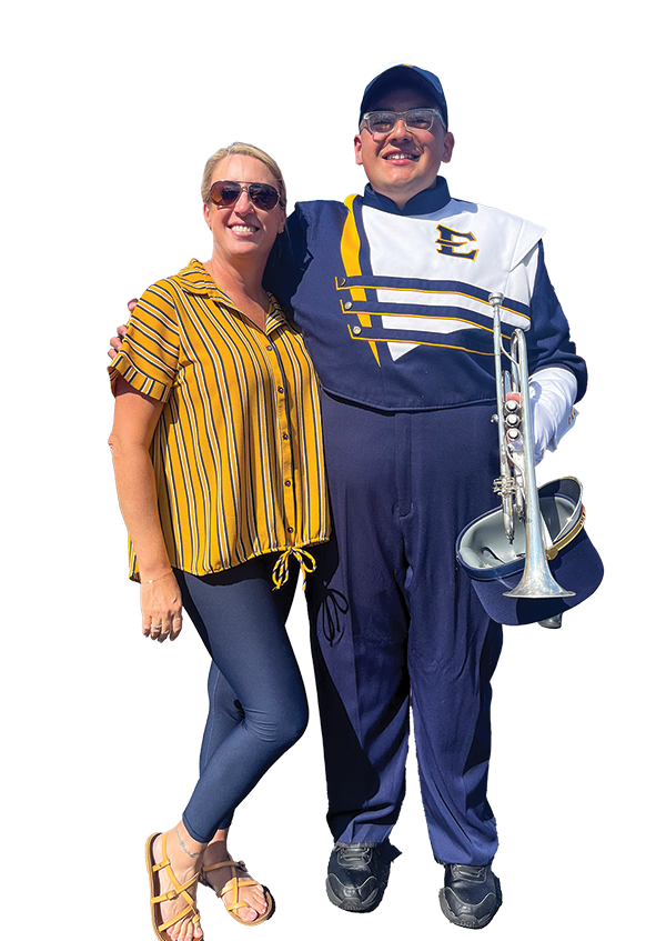 Aaron Fregoso, wearing his ETSU Marching Bucs uniform, puts his arm around his mom.