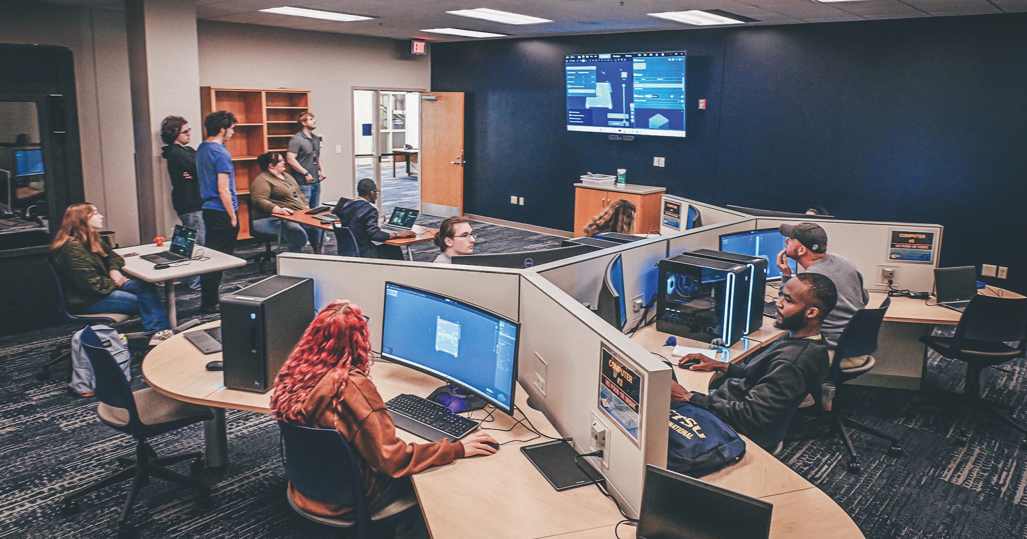 Students work on computers in the Innovation Commons space.
