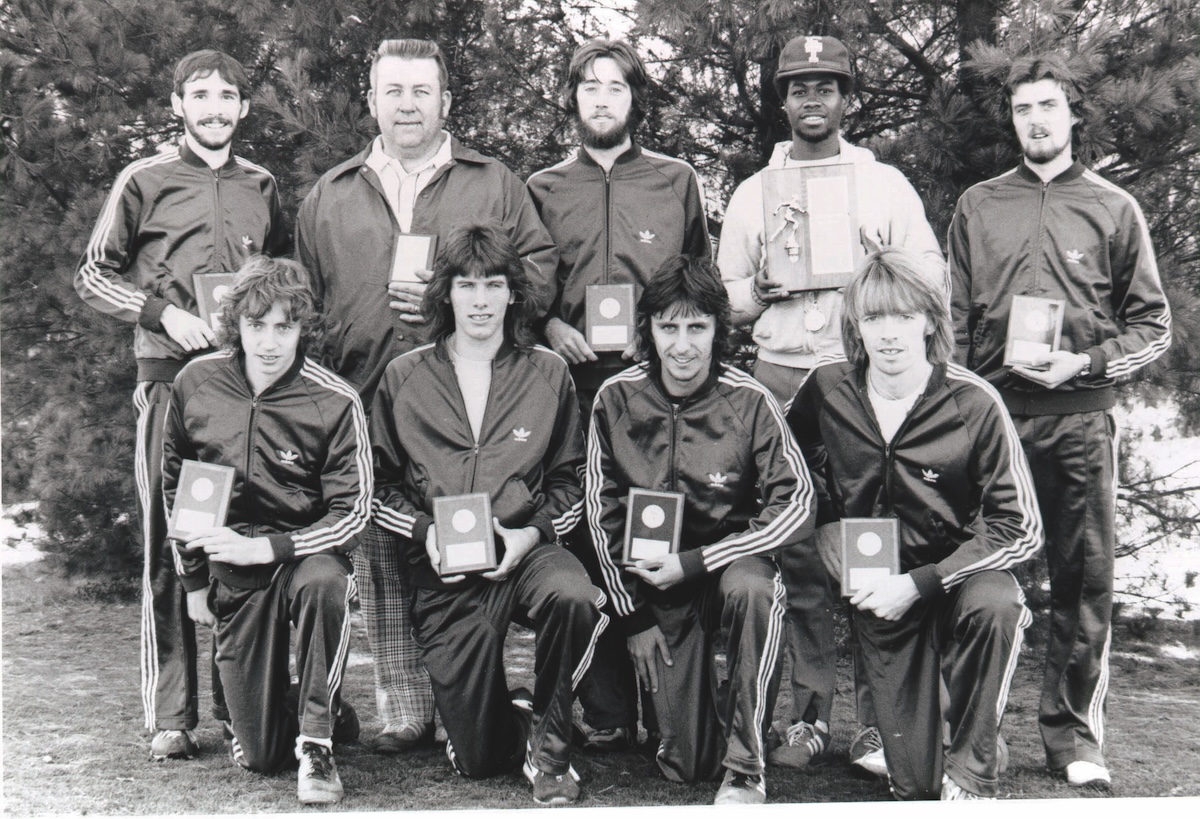 Student athletes lined up and smiled at the camera for a team shot.