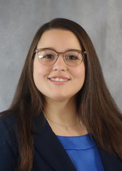 Photo of Elisabeth Dennis Elisabeth is a senior majoring in Psychology and minoring in Biology. She is a McNair Scholar, a member of the Brain-Computer Interface Lab, and an Undergraduate Research Honors Scholar. She currently serves as co-chair of ETSU Votes, Multimedia Editor for the East Tennessean, and as a Supplemental Instruction Leader for General Genetics. Previously, she has served as an SGA Senator. After graduation, she is pursuing a PhD in Biobehavioral Neuroscience, with a focus on schizophrenia and psychosis. As a first-generation student, she is passionate about empowering disadvantaged students through financial aid, scholarships, and her work in collaboration with the Open and Affordable Advisory Council, which seeks to make textbooks more affordable.