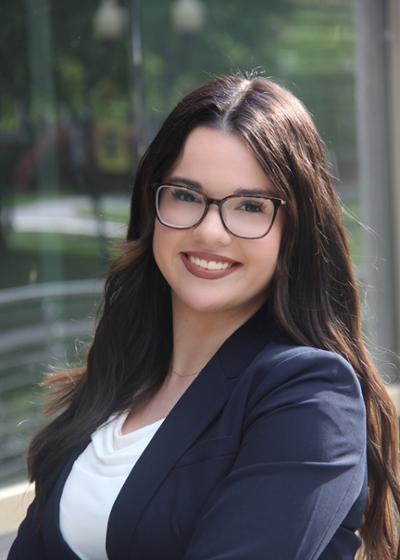 Photo of Emma McElroy Emma is a junior majoring in Social Work. She serves as the Connect Chair for Young Professionals on Campus and is passionate about community building and mental health. She aspires to pursue a career in therapy, specializing in OCD and anxiety. She loves singing, reading, and helping people.