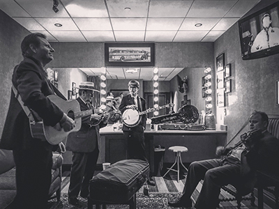 Lincoln Hensley, center, backstage at the Grand Ole Opry with Bobby Osborne and the Rocky Top X-Press (photo contributed by Lincoln Hensley).