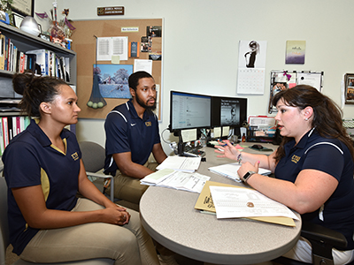 Jessica Mould, right, interacts with fellow Basler Center for Physical Activity employees