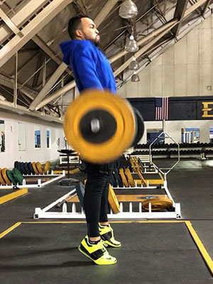 Kinney lifting weights