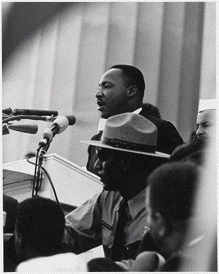 Photo of Martin Luther King Jr speaking at a podium during the 1963 civil rights march on Washington DC. Photo courtesy of the National Archives. 