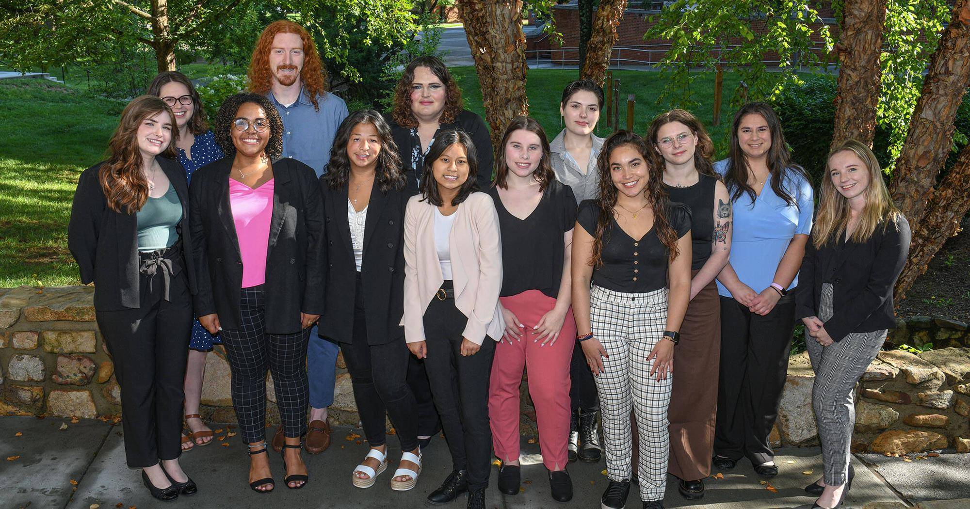 photo of 12 interns and facilitator during the summer 2023 internship
