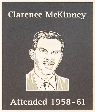 A plaque featuring the engraved portrait of Clarence McKinney