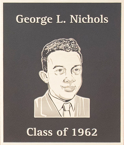 A plaque featuring the engraved portrait of George L. Nichols