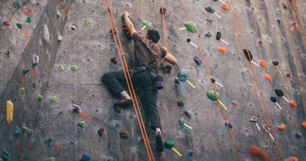 Male Climbing on Climbing Wall