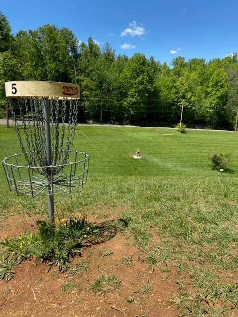Disc Golf Basket and field