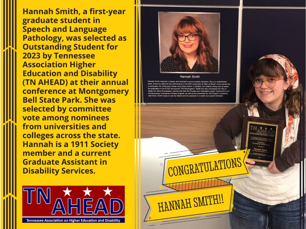 An image of Hannah Smith holding a plaque celebrating her award. Hannah Smith is a member of the 1911 society who won the TNAHEAD scholarship. 