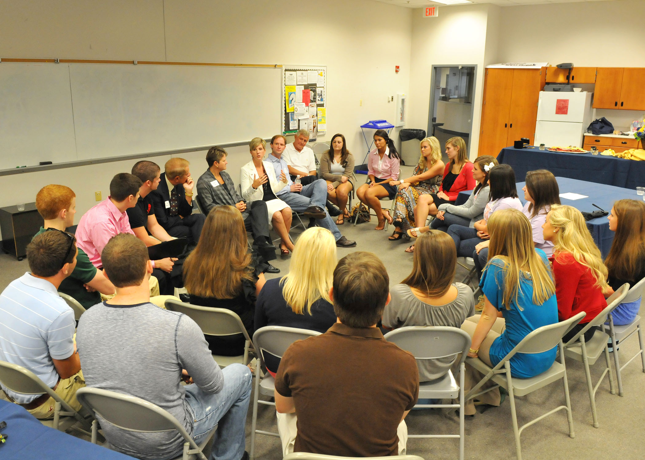 Students and Faculty Sitting in a Circle