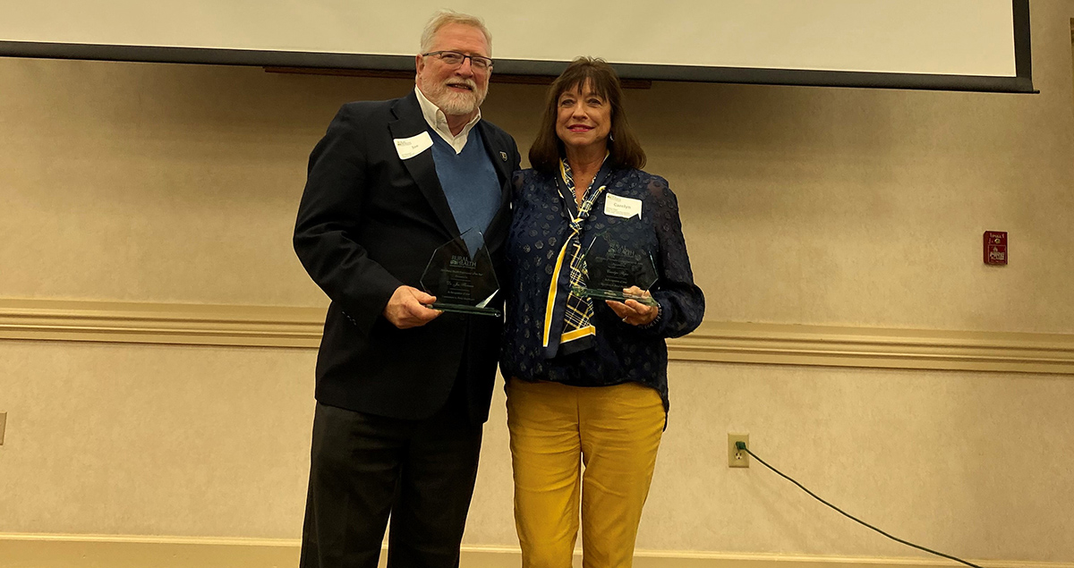 Dr. Joe Florence with the Rural Health Professional of the Year Award; Carolyn Sliger with the Eloise Q. Hatmaker Distinguished Service Award.